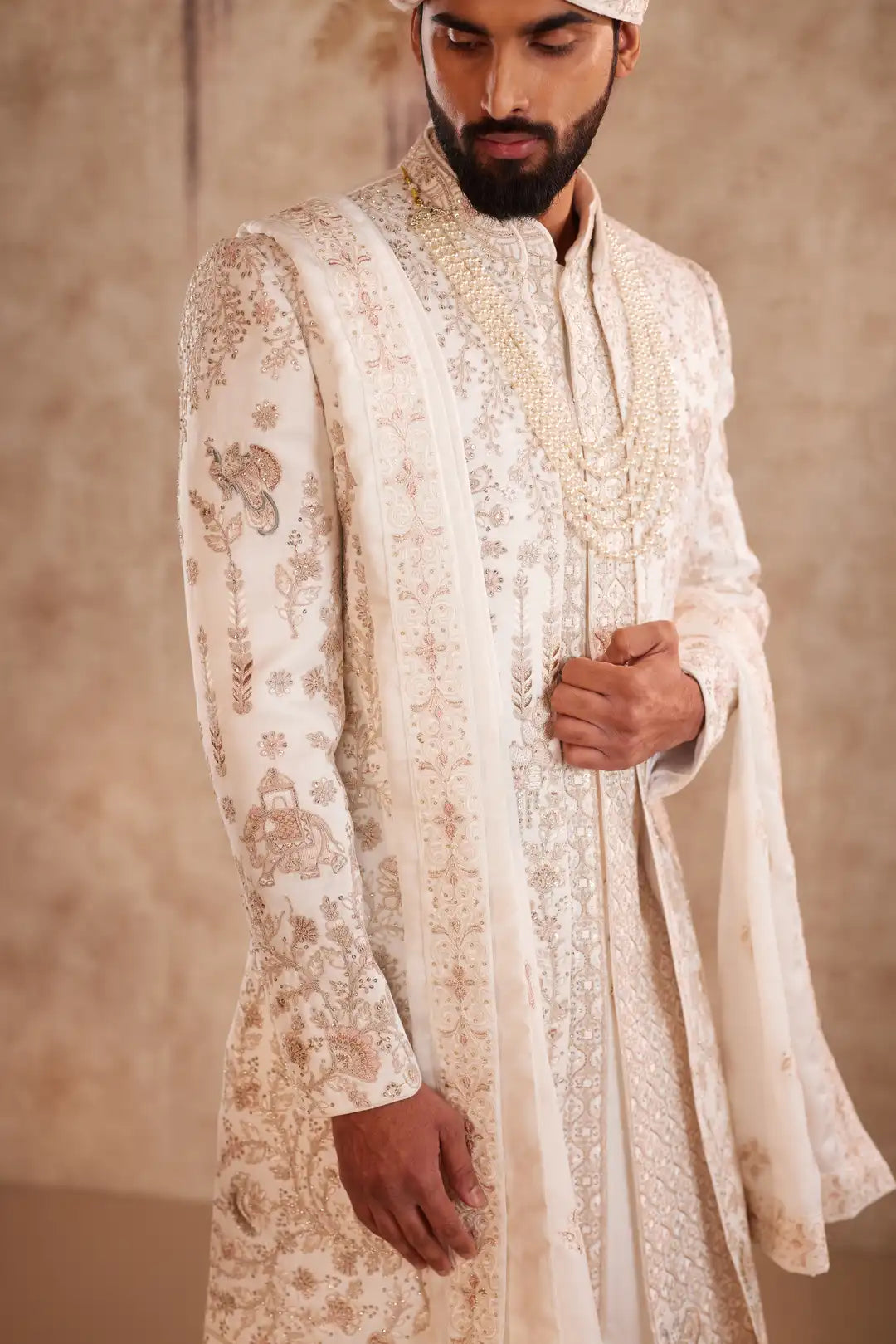 Off white silk Sherwani with pastel floral embroidery