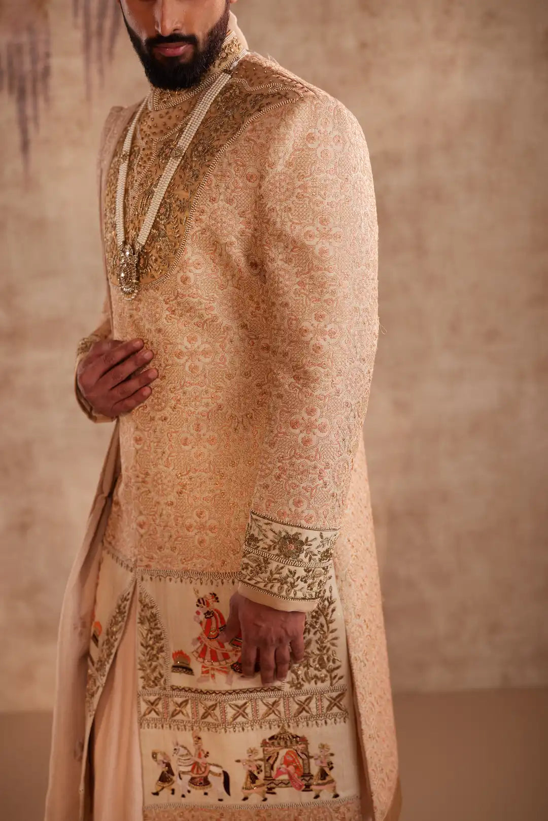 Gold silk Sherwani for groom with intricate hand embroidery