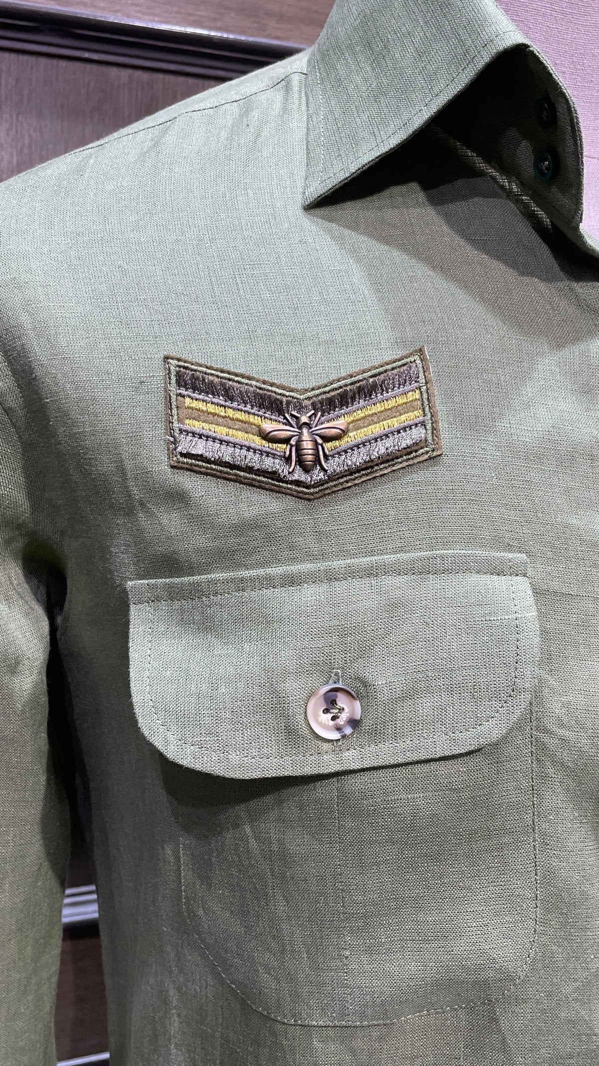 Green linen safari shirt with embroidered badges