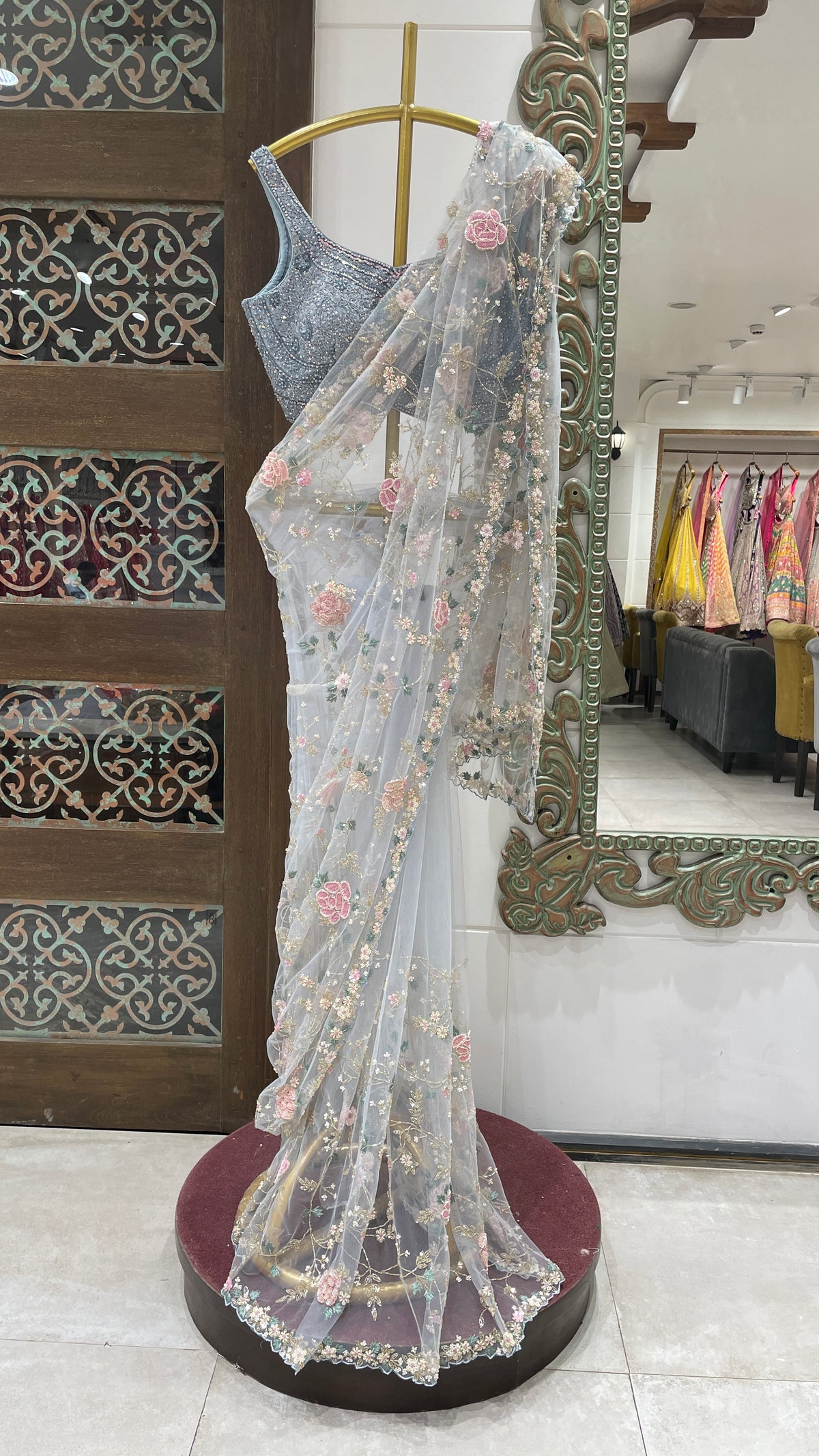 Pastel blue net saree with floral motifs