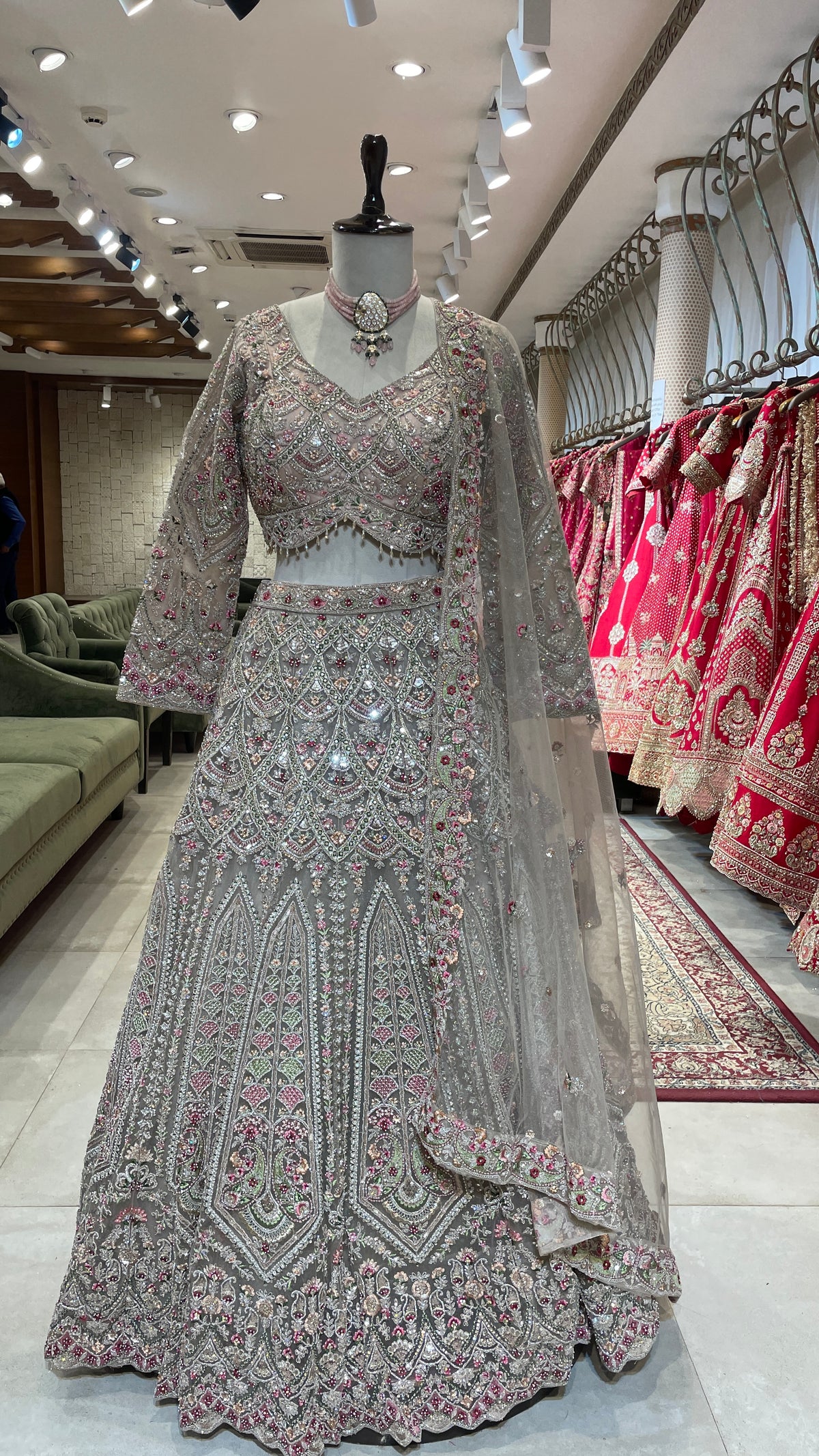 Peach Net Lehenga with Multicolour Threadwork & Embellishments