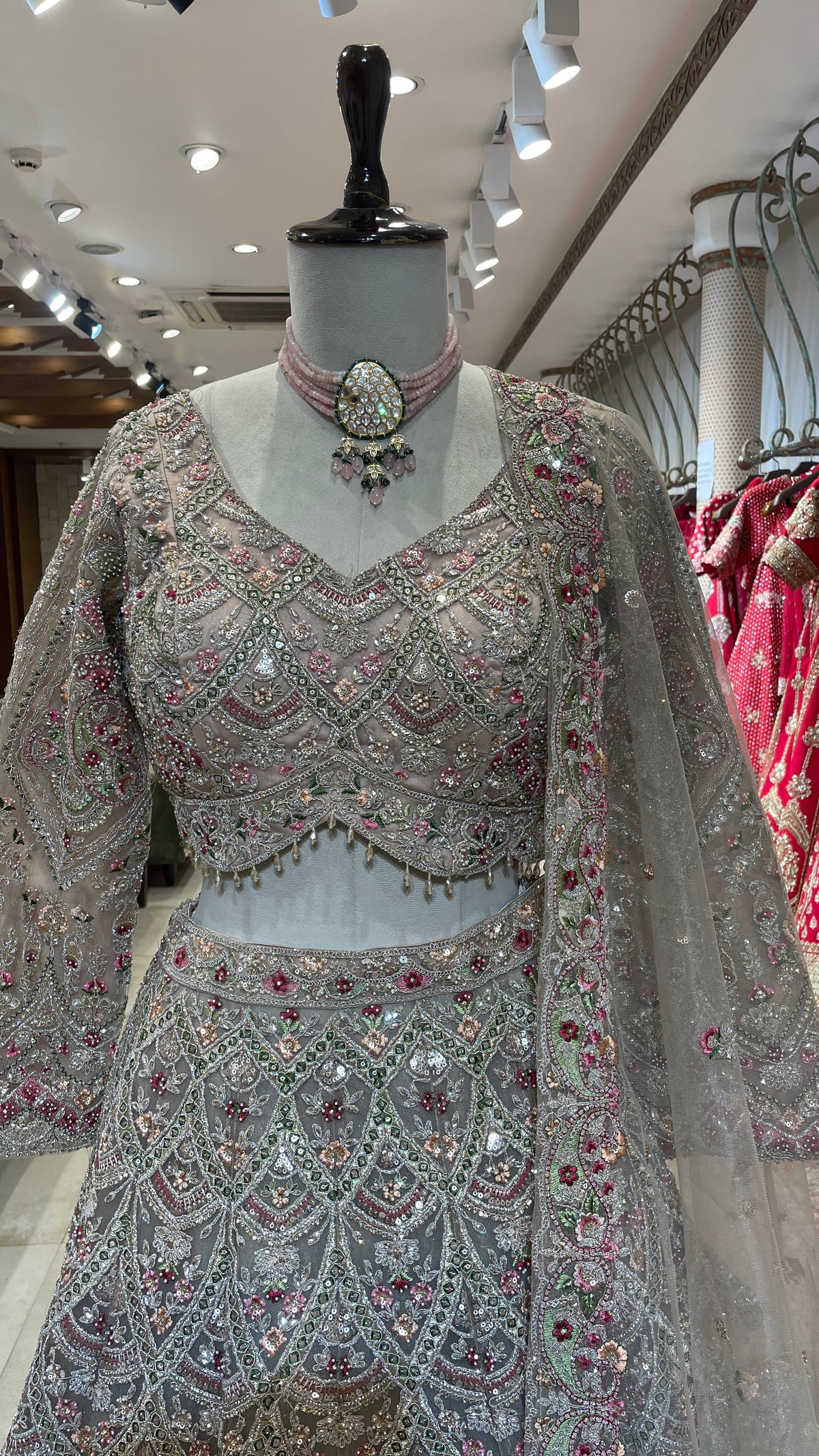 Peach Net Lehenga with Multicolour Threadwork & Embellishments