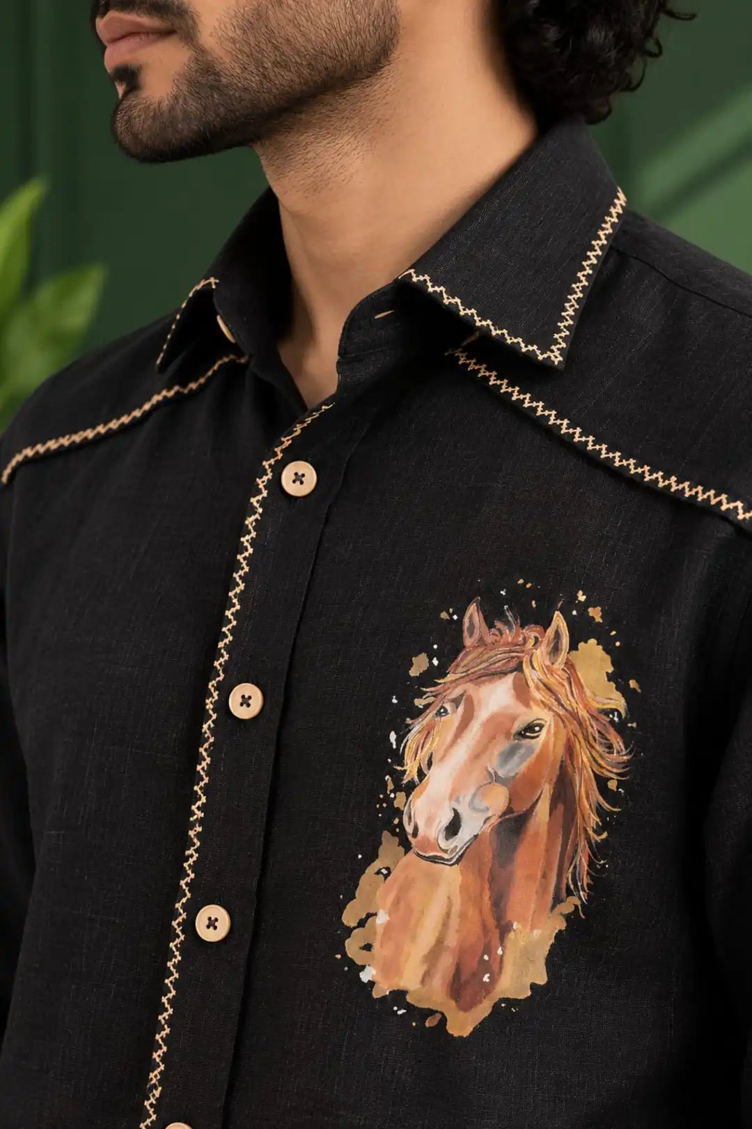 Hand painted black shirt Decorative stitch detailing Shaded buttons Painting motif - horse