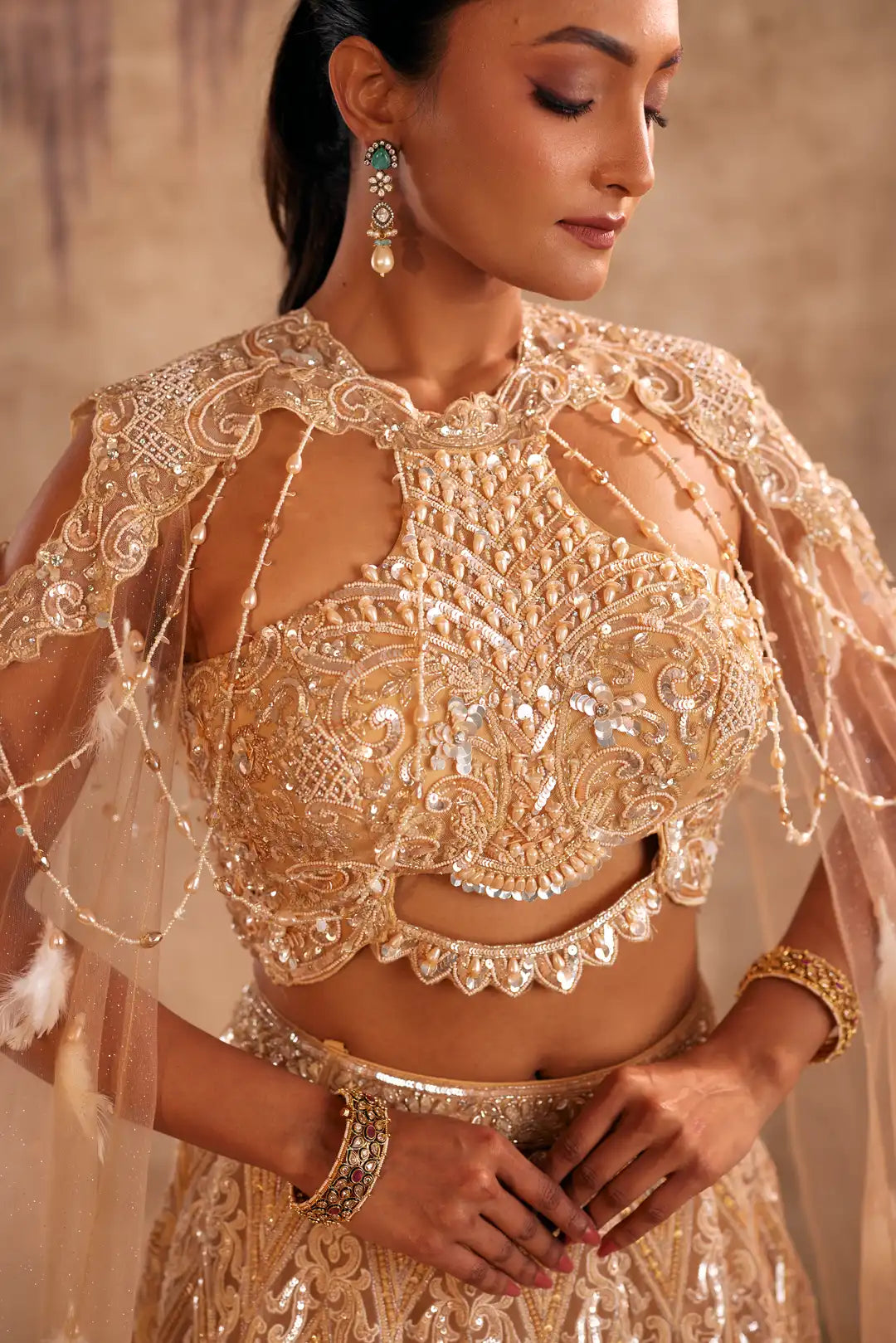Cream Lehenga with Choker Style Cape and Embroidery