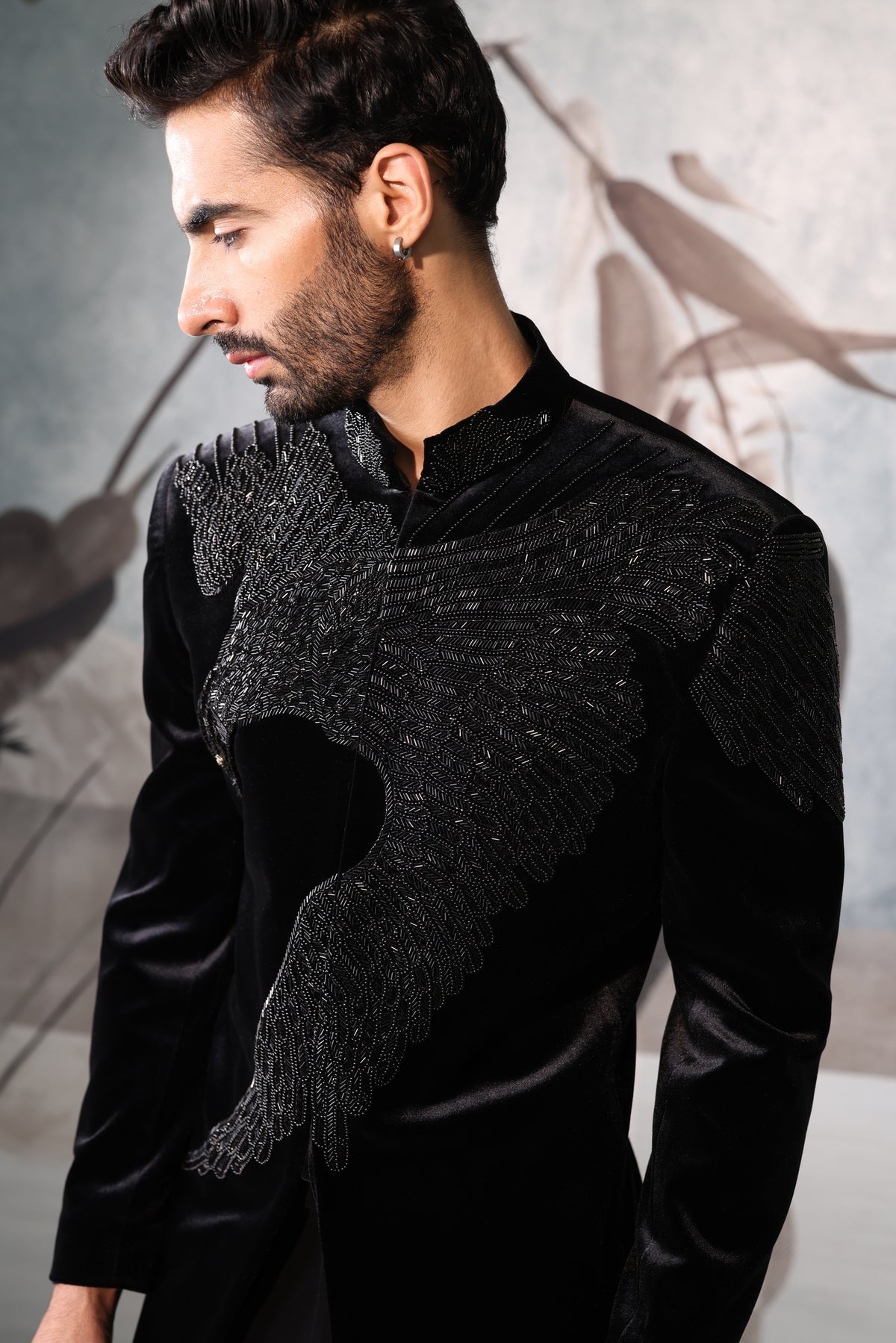 Man wearing a black Bandgala against a neutral background