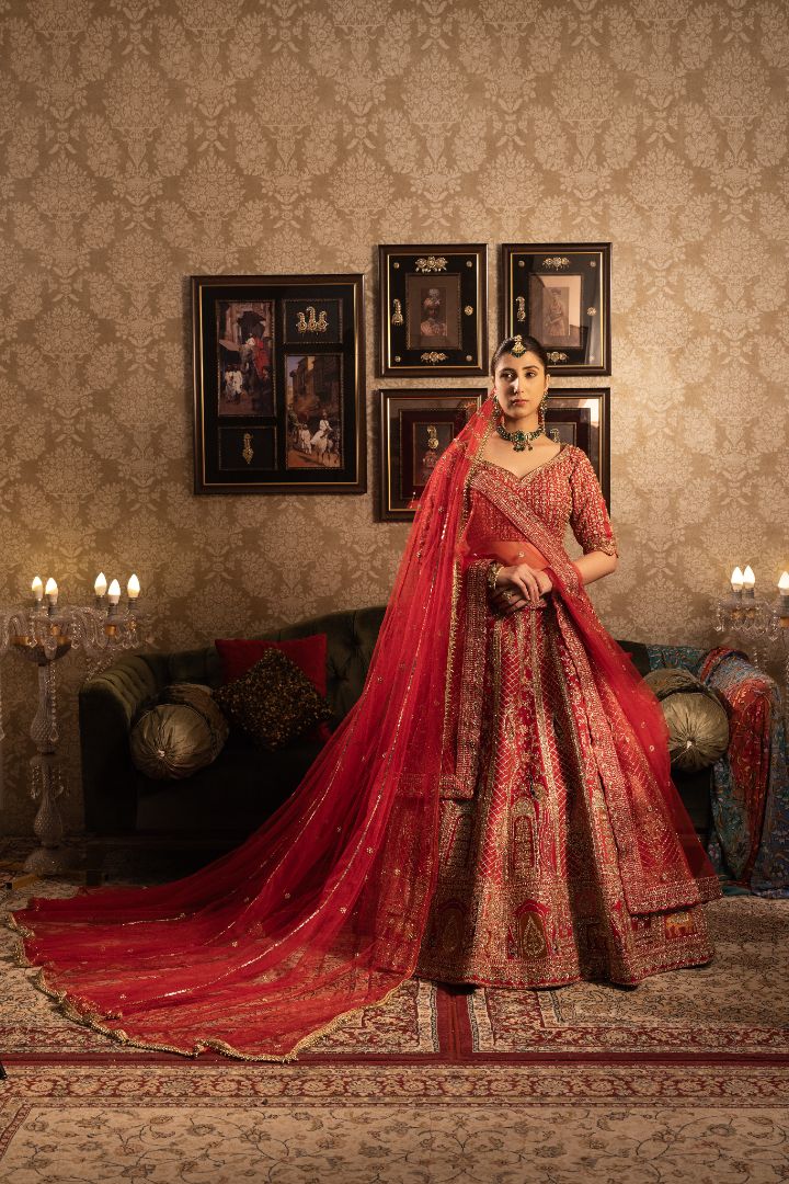 Red Silk Bridal lehenga with jaal work and peacock motifs