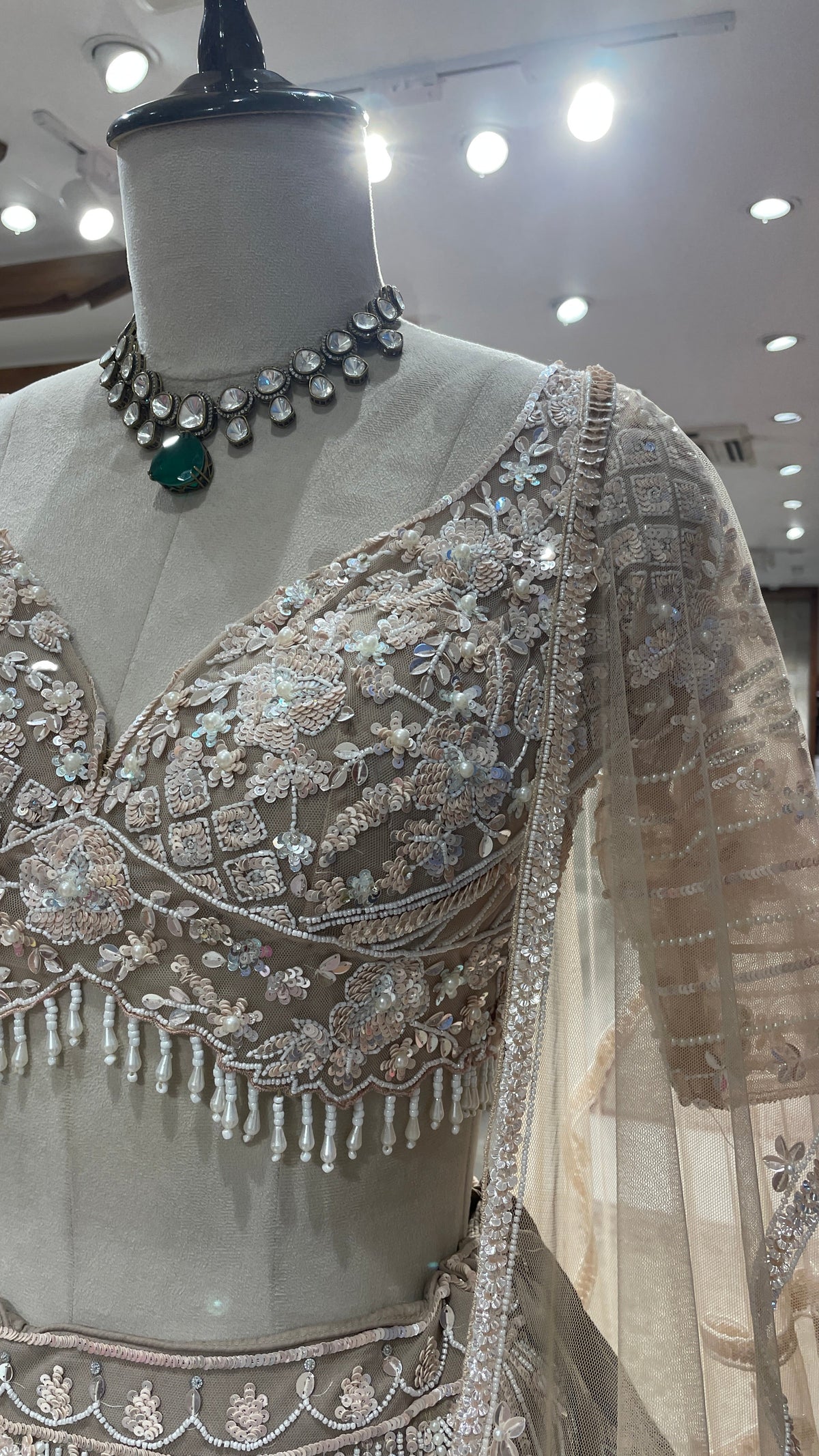Cream Net Lehenga with Sequins & Cutdana Embellishments