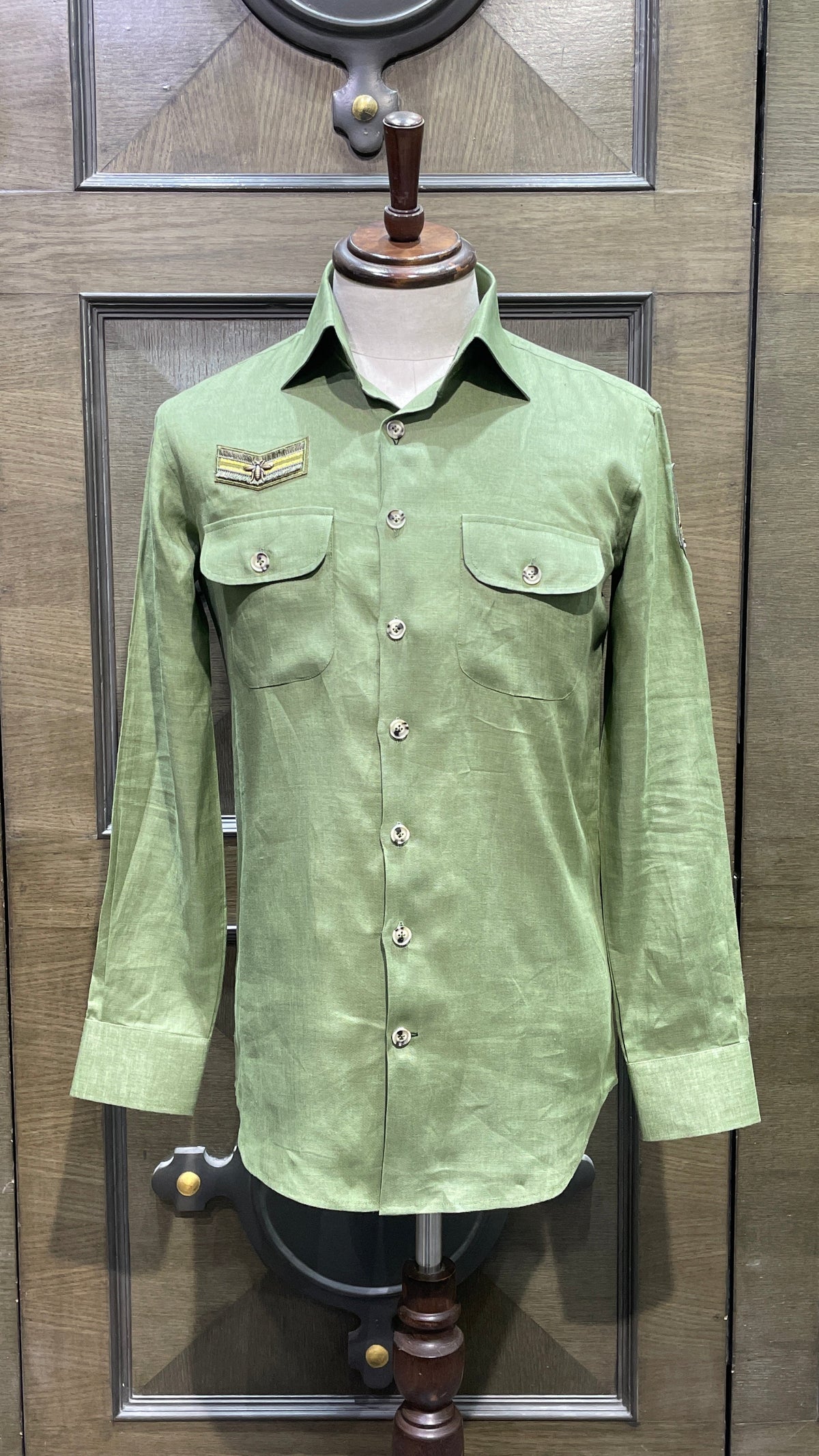Green linen safari shirt with embroidered badges