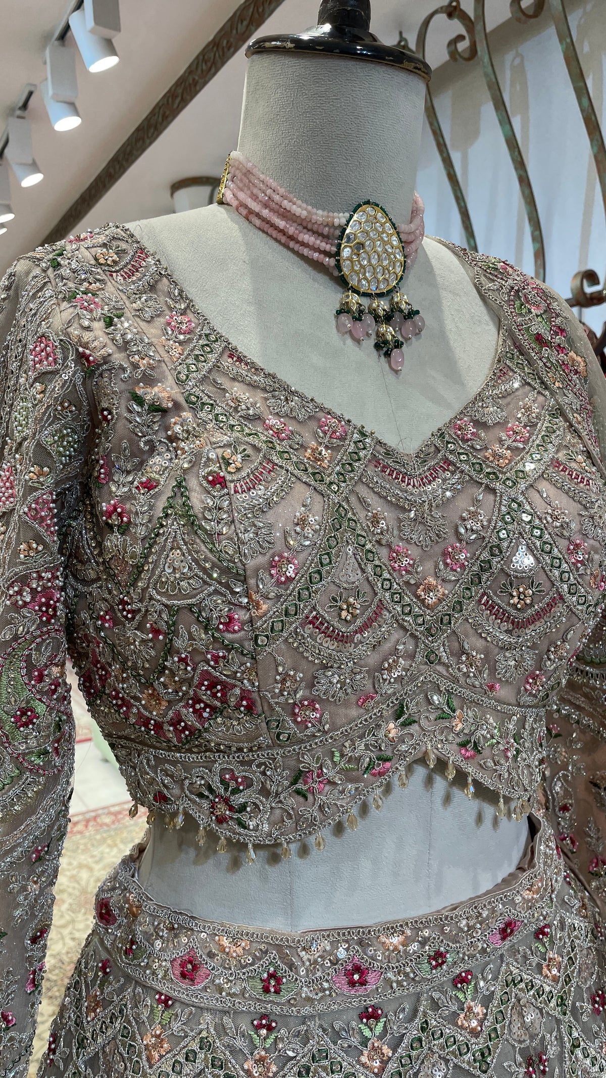 Peach Net Lehenga with Multicolour Threadwork & Embellishments