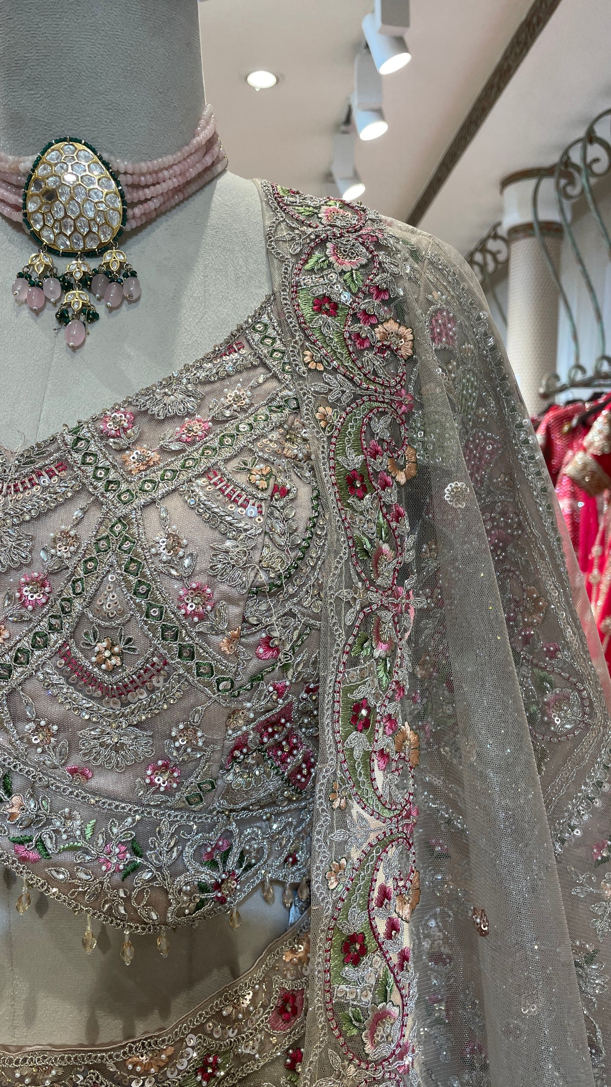 Peach Net Lehenga with Multicolour Threadwork & Embellishments