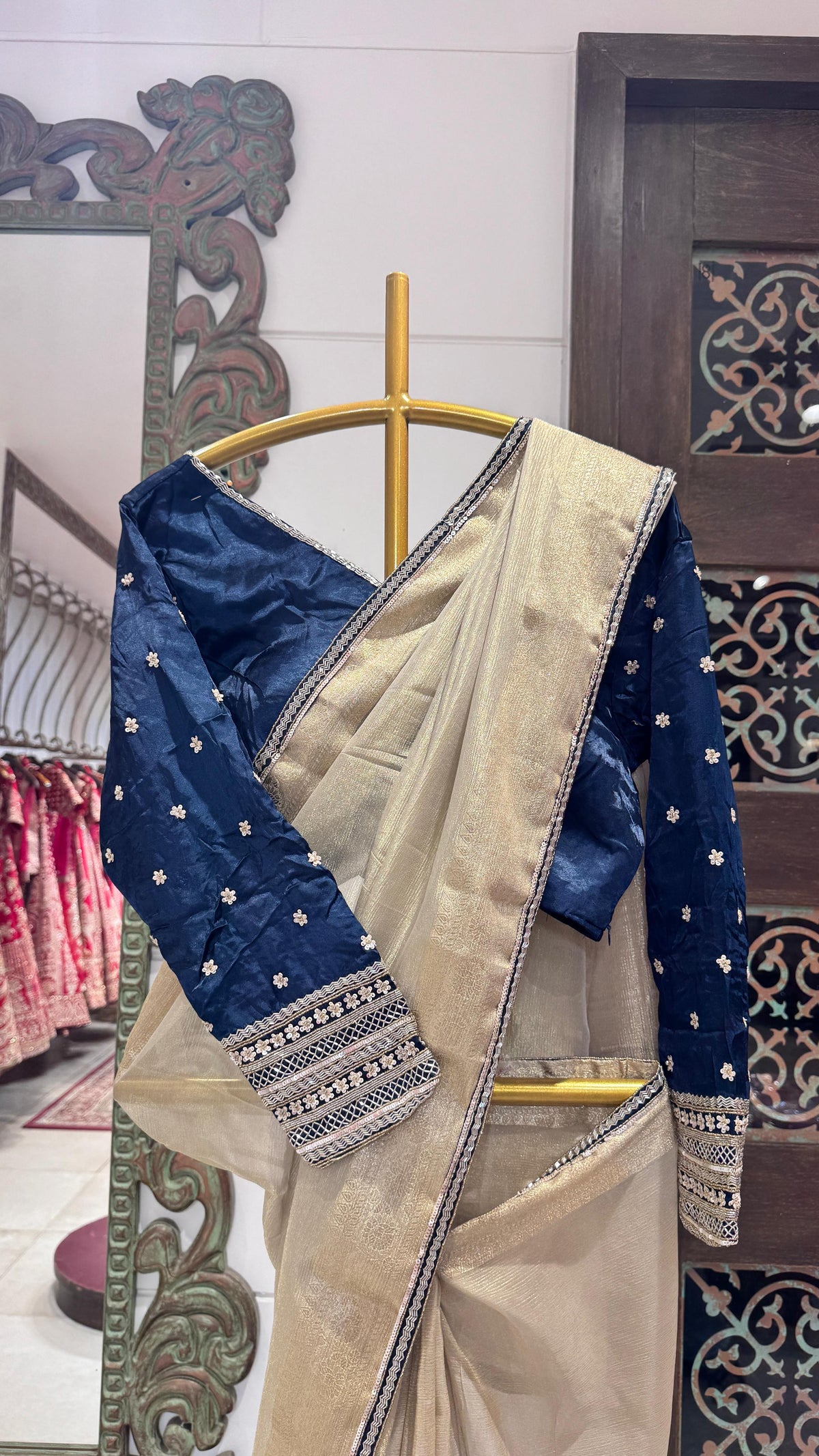 Gold color saree with zig-zag sequience border