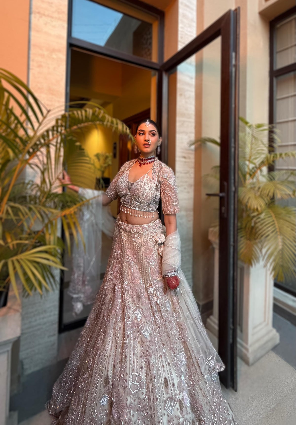 Pink & cream net lehenga with Floral embellishments